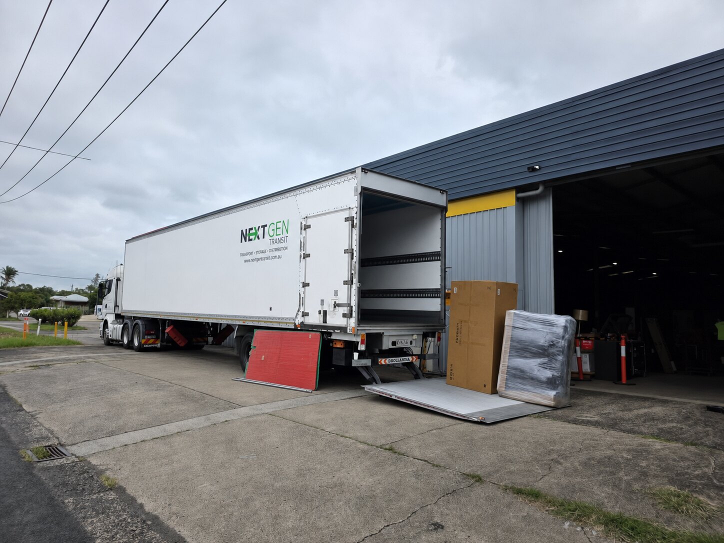 Clean NextGen Transit semi-trailer positioned at a loading dock